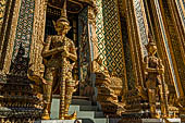 Bangkok Grand Palace, the Wat Phra Keow (temple of the Emerald Buddha), yakshas door guardians of the Phra Mondop library. 